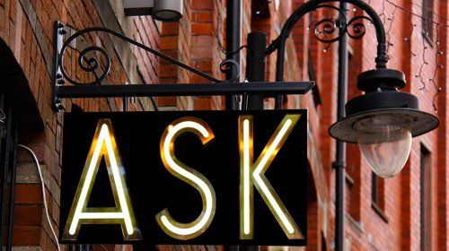 sign post showing the word ask